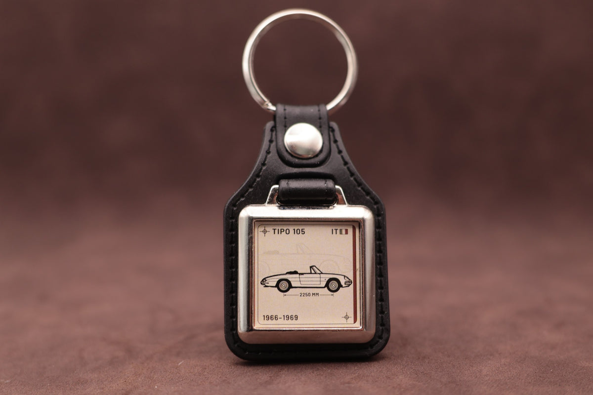 Alfa Romeo Spider 105 Register Series keyring with ivory insert and side-profile vehicle illustration