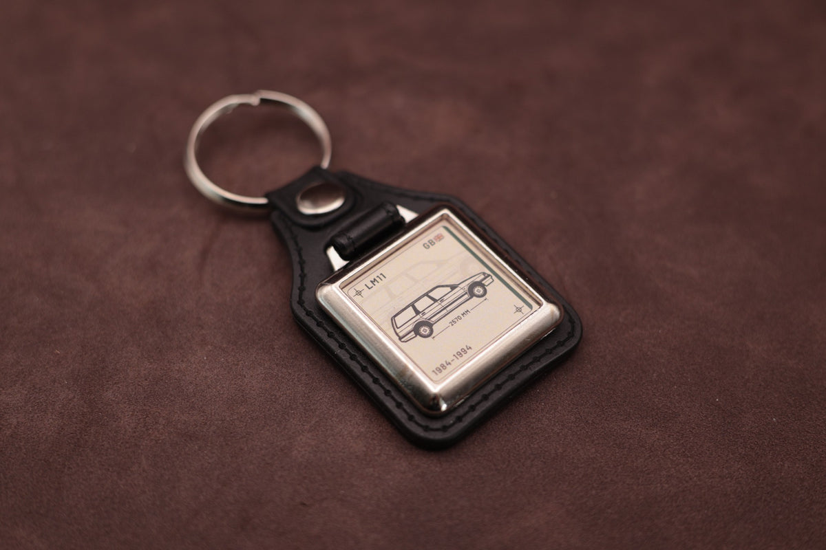 Austin Montego Estate Register Series keyring angled with the split ring at upper left, showing the square chromed frame
