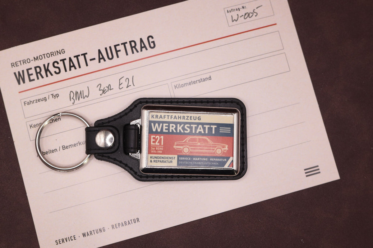 BMW E21 Werkstatt keyring photographed with a Werkstatt reference card