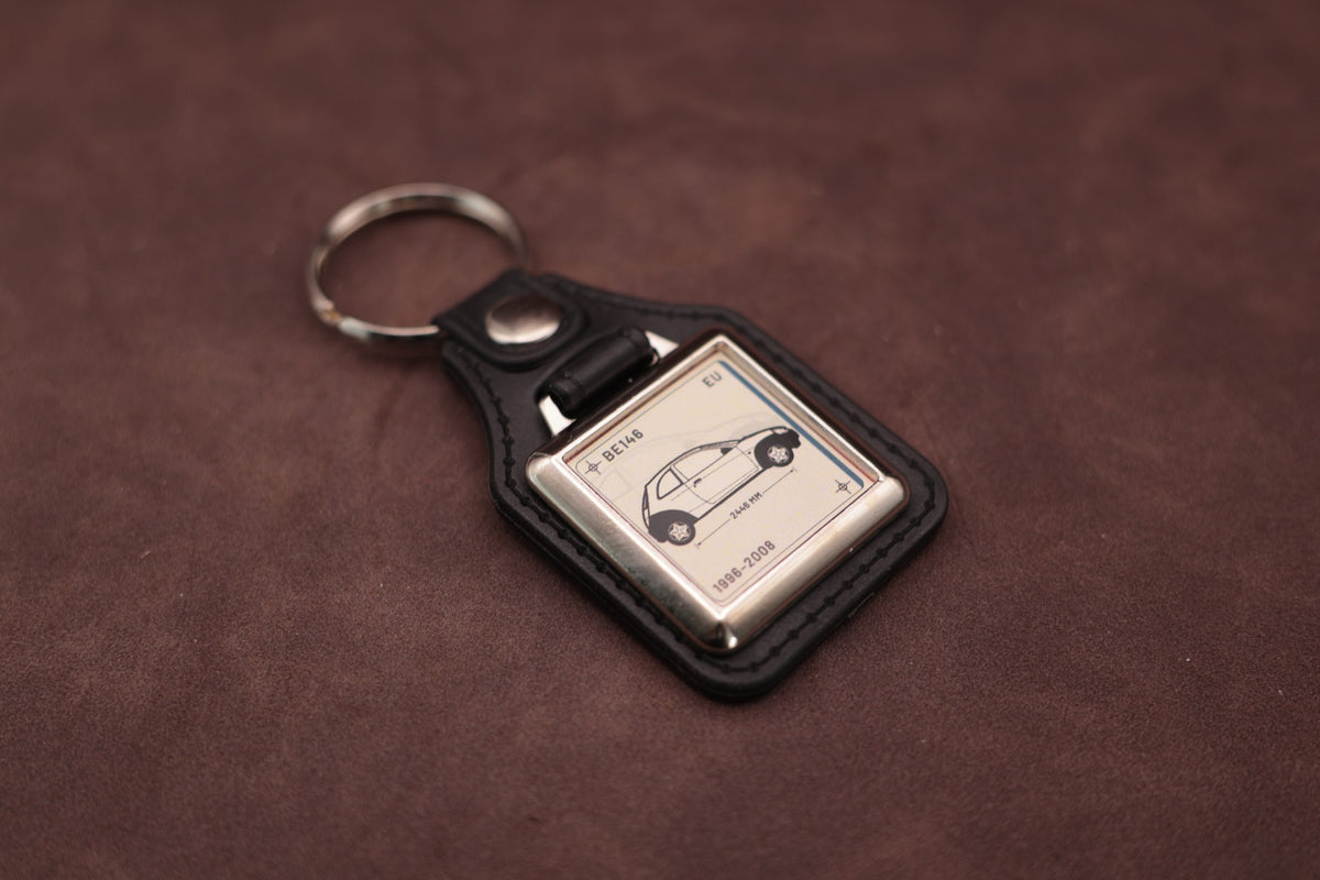 Ford Ka Mk1 Register Series keyring angled with the split ring at upper left, showing the square chromed frame