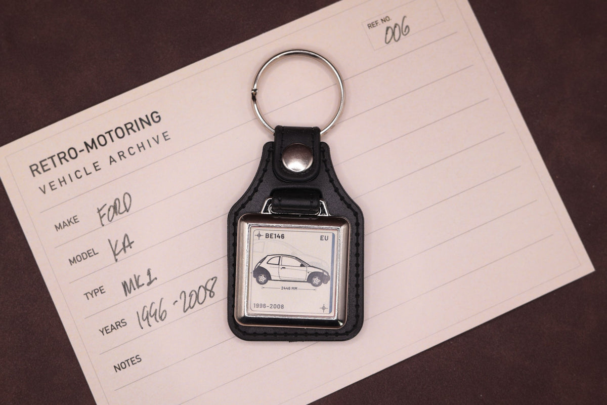 Ford Ka Mk1 Register Series keyring photographed on a Retro-Motoring vehicle archive card