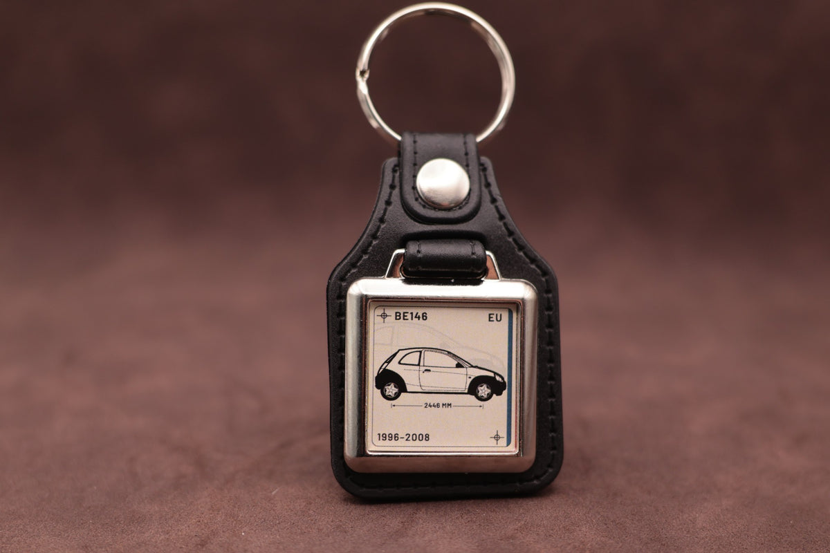 Ford Ka Mk1 Register Series keyring with ivory insert and side-profile vehicle illustration