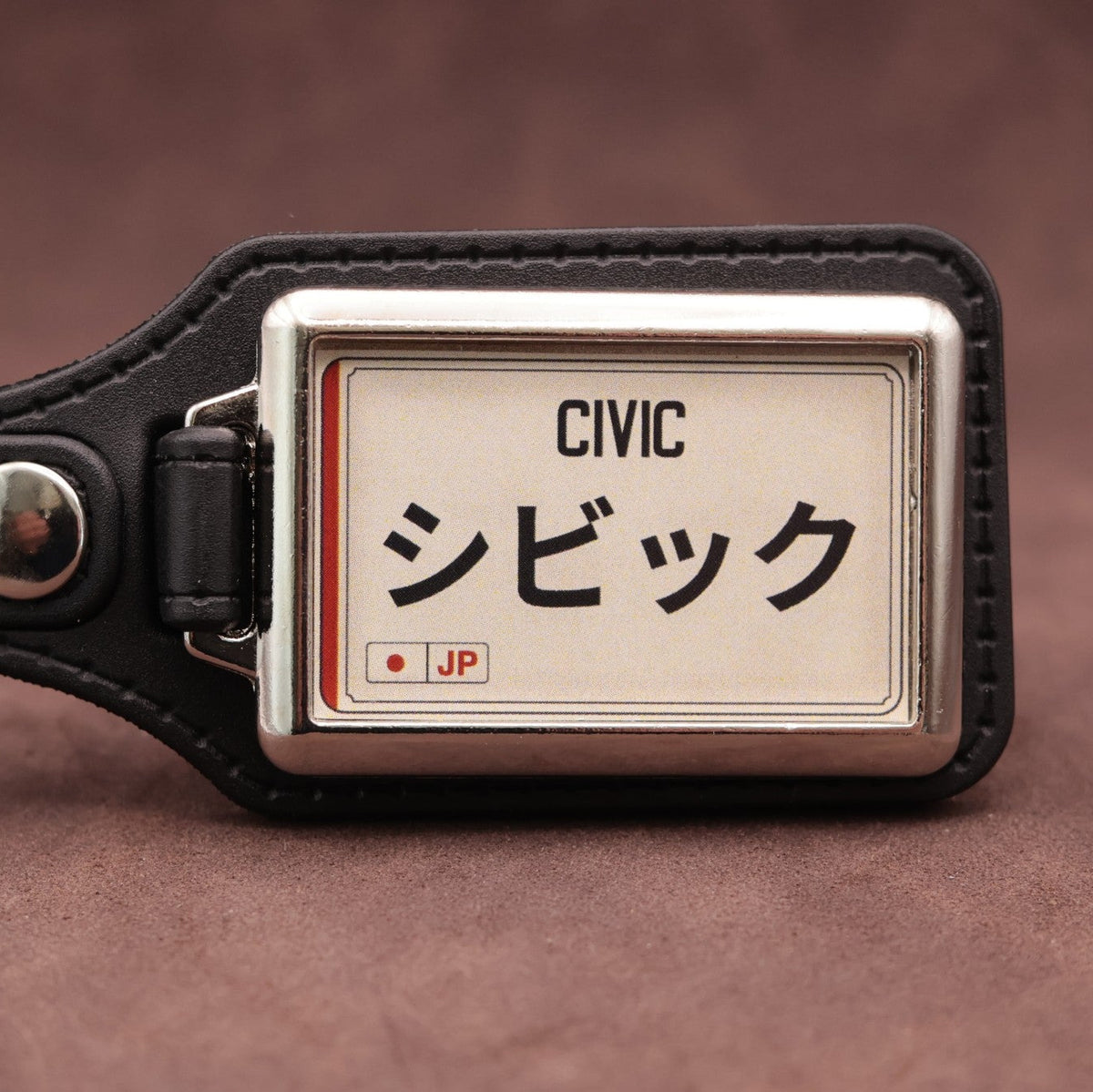 Honda Civic keyring with Japanese katakana and model lettering on a cream plate-inspired insert