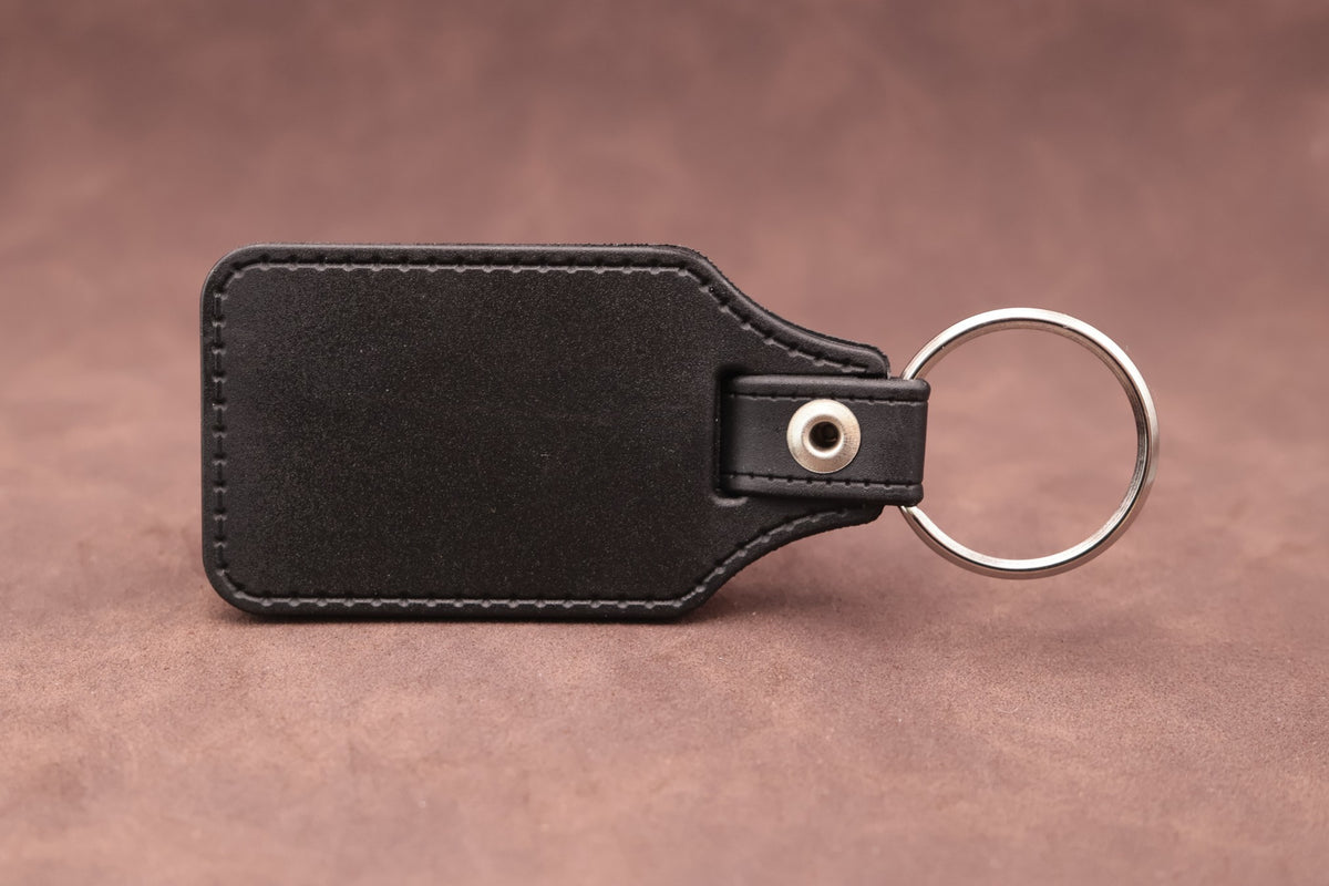 Plain black leatherette reverse with faux stitching and metal split ring