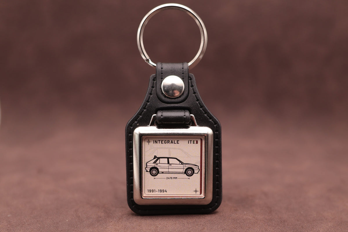 Lancia Delta Integrale Register Series keyring with ivory insert and side-profile vehicle illustration