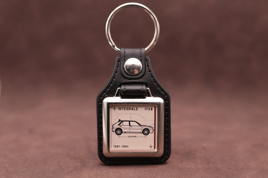 Lancia Delta Integrale Register Series keyring with ivory insert and side-profile vehicle illustration