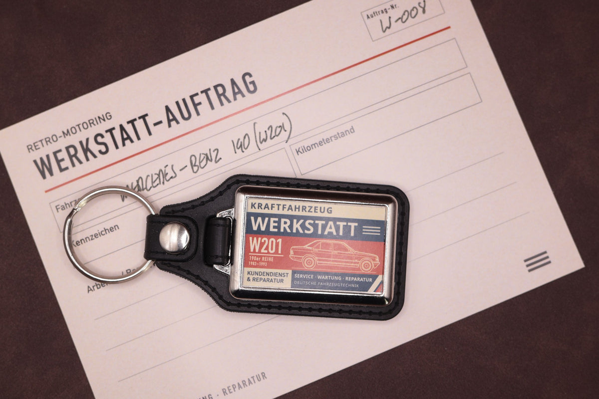 Mercedes-Benz W201 190 Werkstatt keyring photographed with a Werkstatt reference card