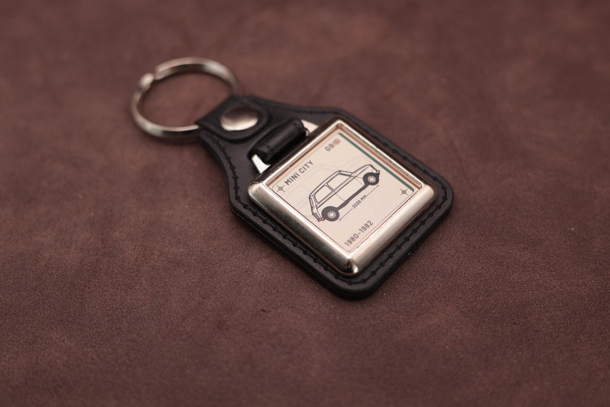 Mini City Register Series keyring angled with the split ring at upper left, showing the square chromed frame