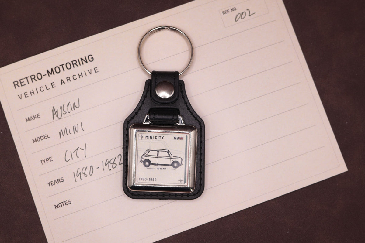 Mini City Register Series keyring photographed on a Retro-Motoring vehicle archive card