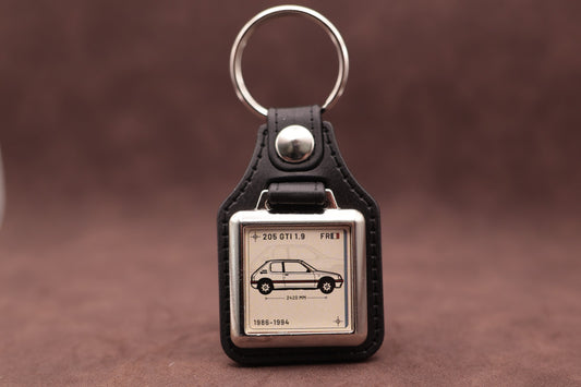 Peugeot 205 GTI 1.9 Register Series keyring with ivory insert and side-profile vehicle illustration