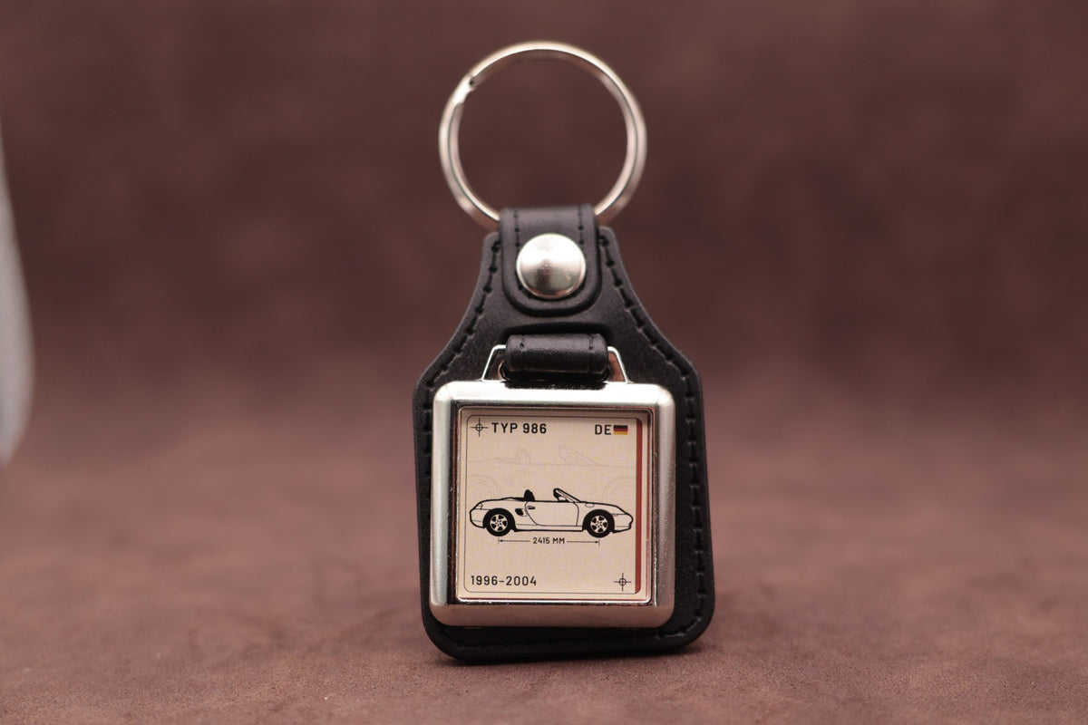 Porsche Boxster 986 Register Series keyring with ivory insert and side-profile vehicle illustration