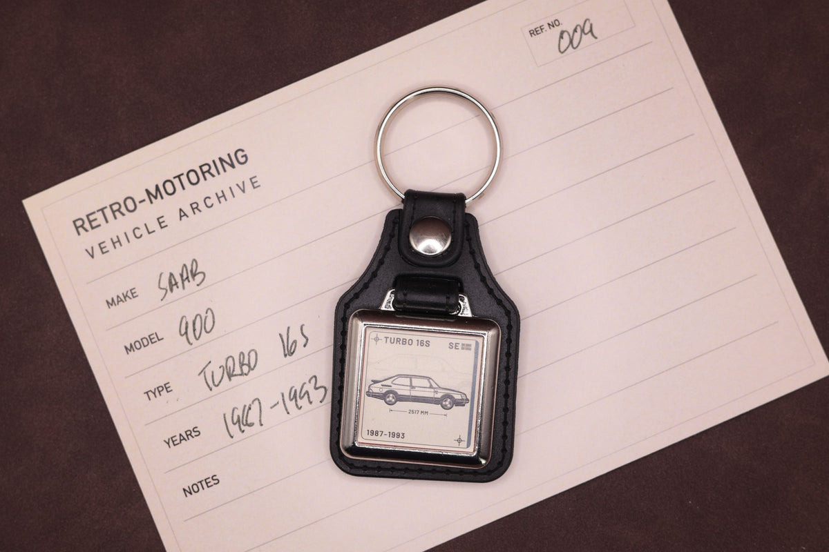 Saab 900 Turbo 16S Register Series keyring photographed on a Retro-Motoring vehicle archive card