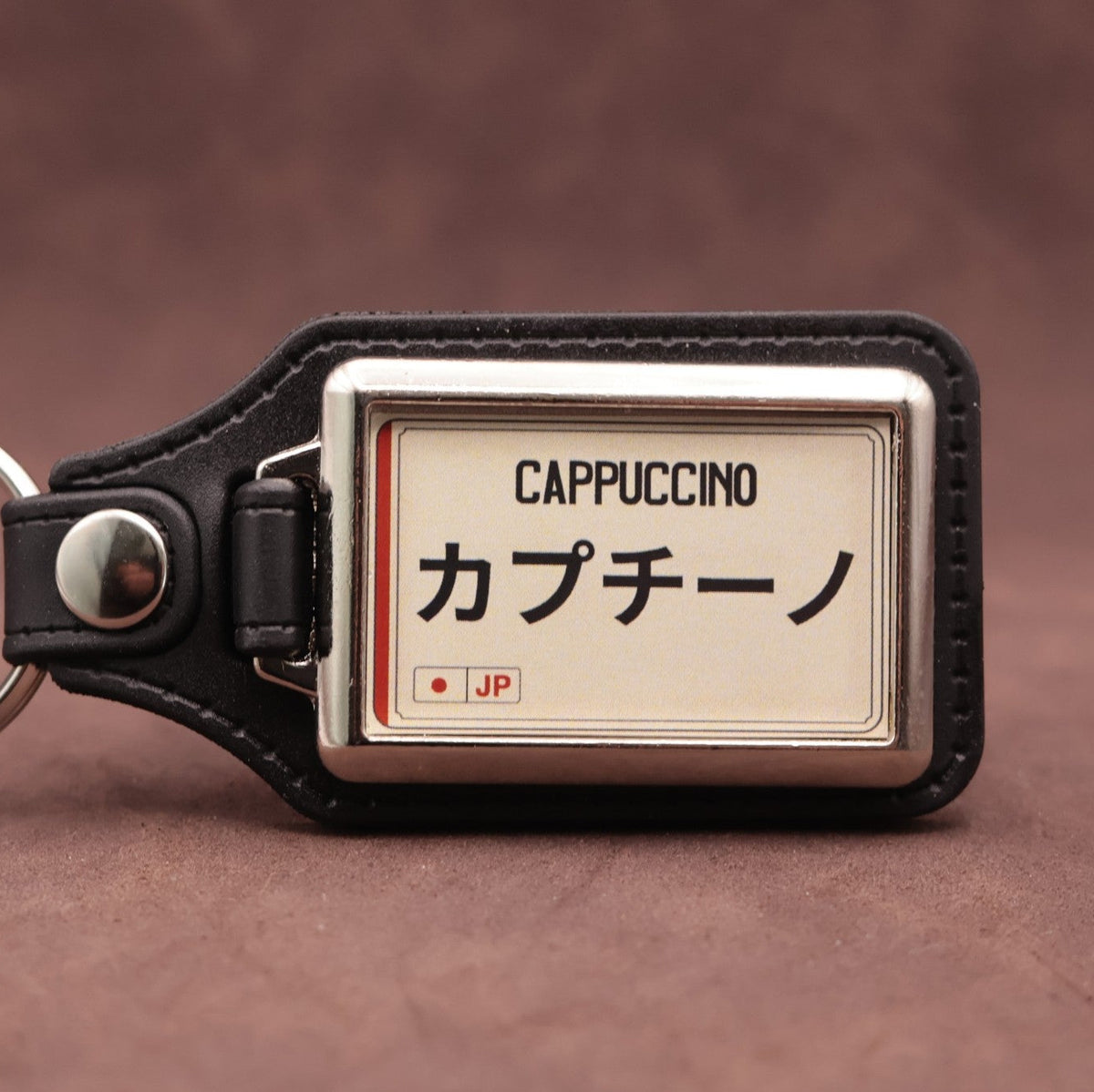 Suzuki Cappuccino keyring with Japanese katakana and model lettering on a cream plate-inspired insert