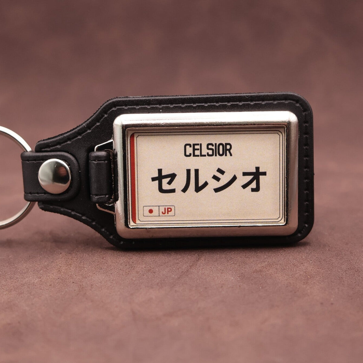 Toyota Celsior keyring with Japanese katakana and model lettering on a cream plate-inspired insert
