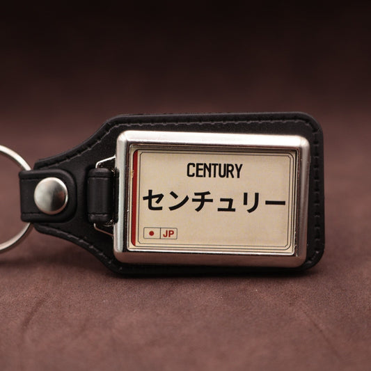 Toyota Century keyring with Japanese katakana and model lettering on a cream plate-inspired insert