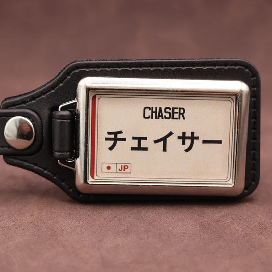 Toyota Chaser keyring with Japanese katakana and model lettering on a cream plate-inspired insert
